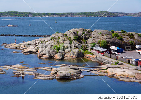Ships harbour at Saltholmen peninsula on the shore of Alvsborgsfjorden, harbour for archipelago ships, Alvsborg district, sunny day, Gothenburg, Sweden Ships harbour at Saltholmen peninsula on the shore of Alvsborgsfjorden, harbour for archipelago ships, Alvsborg district, sunny day, Gothenburg, Sweden 133117573