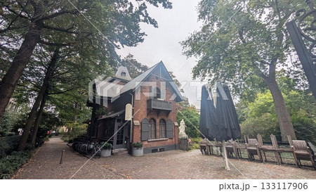 A house looking restaurant in a garden park in Antwerp A house looking restaurant in a garden park in Antwerp 133117906