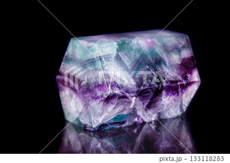 Macro mineral stone Fluorite crystal on a black background Macro mineral stone Fluorite crystal on a black background 133118283