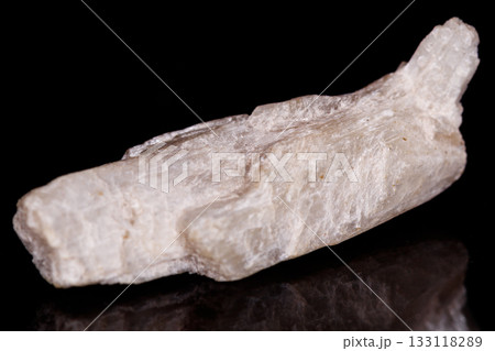 Macro mineral stone Orthoclase on black background 133118289
