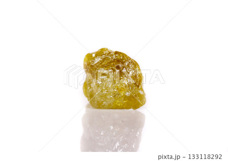 Macro mineral stone Green pomegranate on white background Macro mineral stone Green pomegranate on white background 133118292