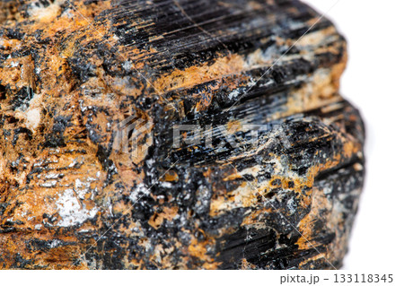 macro mineral stone sherle, schorl, black tourmaline on white background macro mineral stone sherle, schorl, black tourmaline on white background 133118345