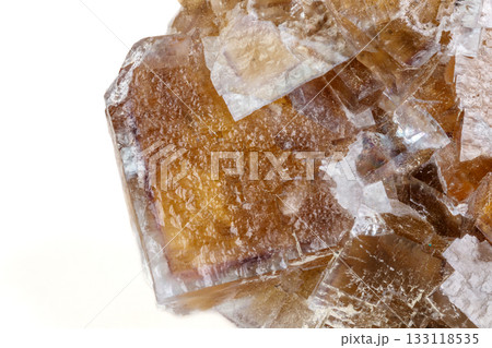 Macro mineral stone yellow Fluorite on a white background 133118535