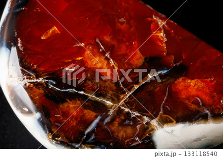 Macro mineral stone Cornelian on a black background Macro mineral stone Cornelian on a black background 133118540