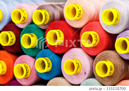 set of multi-colored spools of thread for sewing 133118700