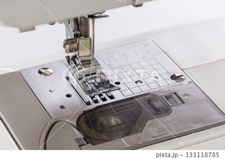 Sewing machine, stitching fabrics, needle in a round plan Sewing machine, stitching fabrics, needle in a round plan 133118785