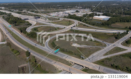 Vehicles are moving along the complex highway interchange 133119004