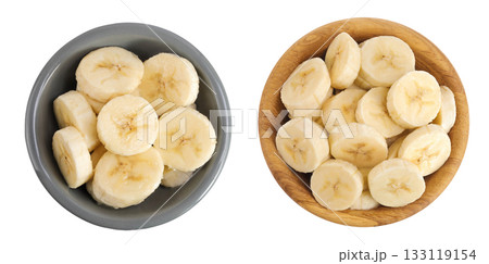 peeled banana pieces in ceramic and wooden bowl isolated on white background. Top view. Flat lay. peeled banana pieces in ceramic and wooden bowl isolated on white background. Top view. Flat lay. 133119154