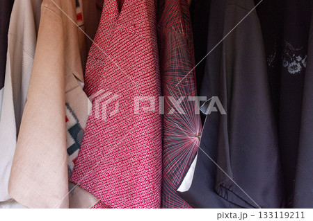 Chic wardrobe showcasing diverse jackets in cozy urban home 133119211