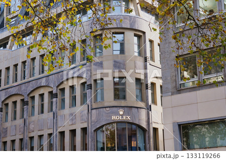 Elegant building housing a luxury watch brand in a city setting with autumn leaves Elegant building housing a luxury watch brand in a city setting with autumn leaves 133119266