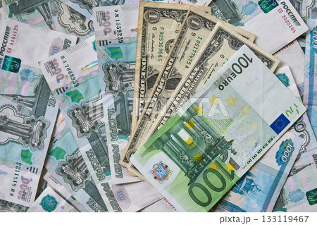 background of paper bills dollars, euros and rubles. Currency exchange rate 133119467