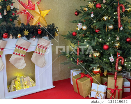 Cozy room with fireplace and Christmas tree Cozy room with fireplace and Christmas tree 133119622