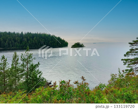A beach with a body of water in the background. A beach with a body of water in the background. 133119720