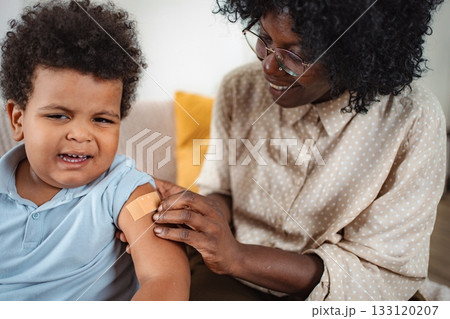 Doctor checking child's heartbeat with stethoscope 133120207