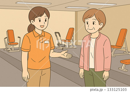 機能訓練特化型デイサービスで運動マシンを説明する職員と利用者 133125103