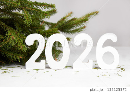 Happy New Year greeting card 2026. Spruce branches, white wooden numbers 2023.  133125572