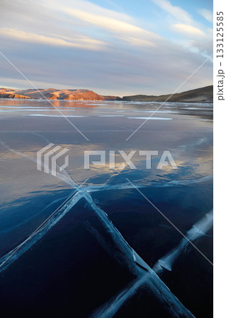 Frozen Lake Baikal on a sunny winter day.  133125585