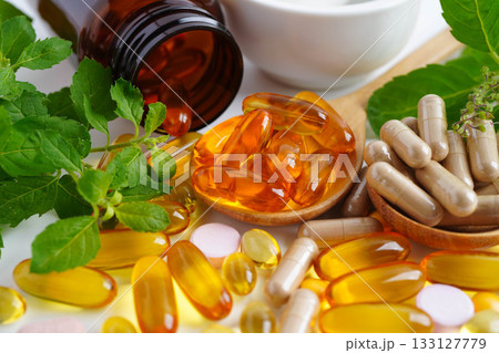 Alternative medicine herbal organic capsule with vitamin E omega 3 fish oil, mineral, drug with herbs leaf natural supplements for healthy good life. Alternative medicine herbal organic capsule with vitamin E omega 3 fish oil, mineral, drug with herbs leaf natural supplements for healthy good life. 133127779