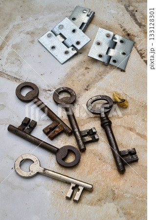 Set of keys on marble table 133128301