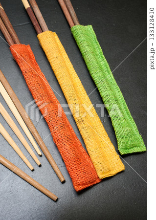 Wooden chopstick in Colored tissue 133128410