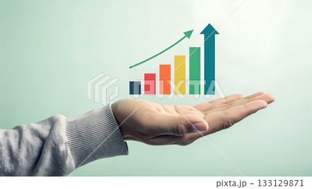 Holding a vibrant bar chart showcasing business growth and success, perfect for illustrating financial gains and positive market trends in presentations Holding a vibrant bar chart showcasing business growth and success, perfect for illustrating financial gains and positive market trends in presentations 133129871