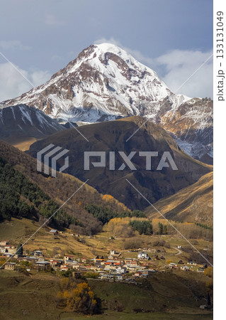 Vertical view of autumn Mount Kazbek, Stepantsminda, Georgia. Vertical view of autumn Mount Kazbek, Stepantsminda, Georgia. 133131049