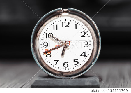 Old retro clock with rust, old table clock 133131769
