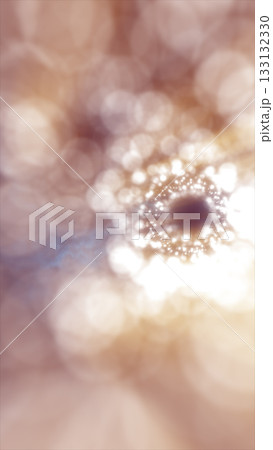 Soft golden bokeh circles forming a glowing abstract pattern with bright light at the center Soft golden bokeh circles forming a glowing abstract pattern with bright light at the center 133132330