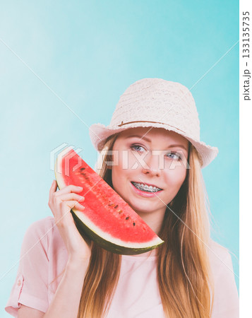 Happy woman holding watermelon Happy woman holding watermelon 133135735