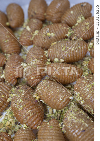 Lebanese recipe for Maakaroun fritters: fine wheat semolina, flour, butter, oil, ground anise 133136255