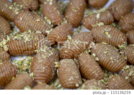 Lebanese recipe for Maakaroun fritters: fine wheat semolina, flour, butter, oil, ground anise Lebanese recipe for Maakaroun fritters: fine wheat semolina, flour, butter, oil, ground anise 133136259