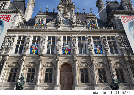 City Hall of Paris, France building adorned with colorful flags and rich architecture 133136271
