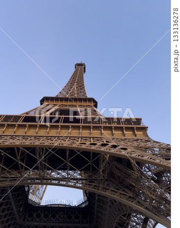 Experience the majesty of the Eiffel Tower from below on a sunny day Experience the majesty of the Eiffel Tower from below on a sunny day 133136278