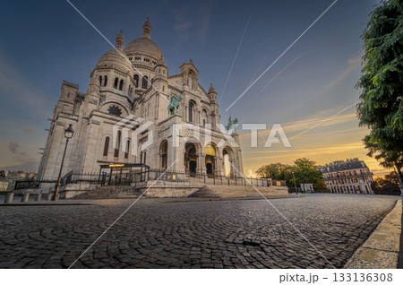 Montmartre sunset view of Sacre Coeur Basilica in Paris with vibrant skies 133136308