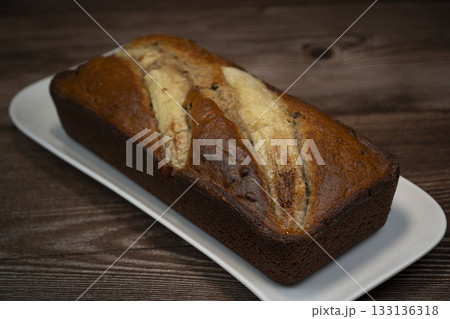 Delicious banana bread dessert on a white plate 133136318