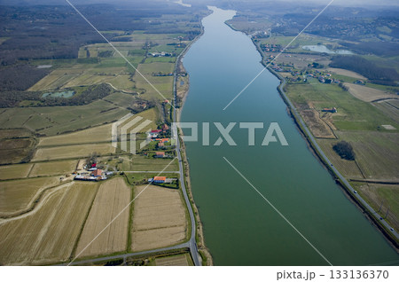 Scenic aerial view of the Adour river in Urt, Landes region 133136370