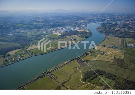 Scenic aerial view of the Adour river in Urt, Landes region 133136382