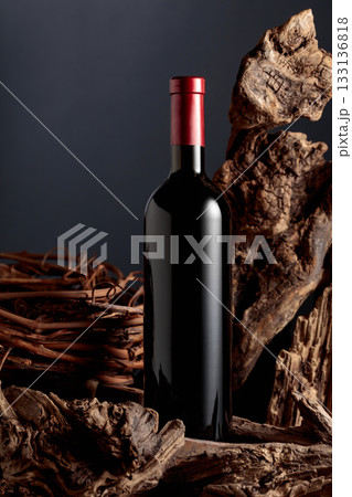 Unopened bottle of red wine and old dried snags. Unopened bottle of red wine and old dried snags. 133136818
