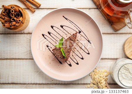 Chocolate cheesecake slice with mint 133137463