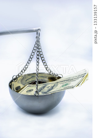 Money and justice concept with dollar bills on scale closeup. 133139157