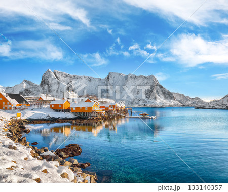 Amazing winter view of Sakrisoy village and snowy mountaines on background. 133140357