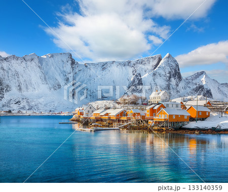 Amazing winter view of Sakrisoy village and snowy mountaines on background. 133140359