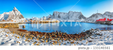Amazing winter view of Sakrisoy village and snowy mountaines on background. 133140381