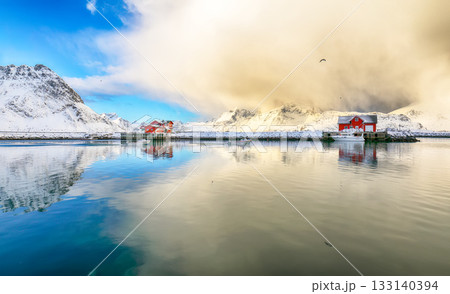 Amazing morning view of small fishing village Ramberg at sunrise. Amazing morning view of small fishing village Ramberg at sunrise. 133140394