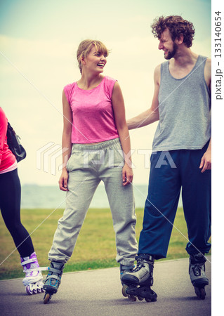 roller skater couple skating outdoor 133140654