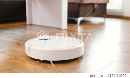 White robot vaccum cleaner in the living room White robot vaccum cleaner in the living room 133141001