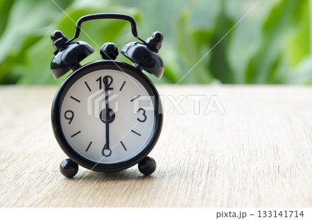 Alarm clock pointing at 6 pm with customizable background space for text or ideas. Time concept. 133141714