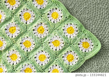 Handmade granny square blanket with daisy flowers 133144821