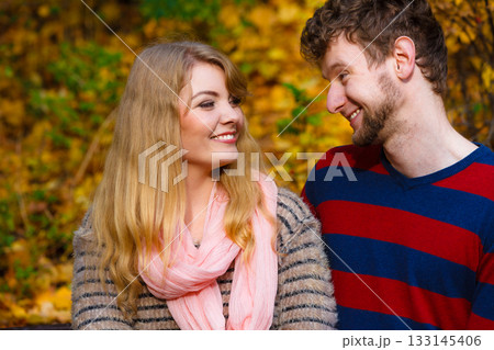 Lovers couple in autumn park on bench Lovers couple in autumn park on bench 133145406