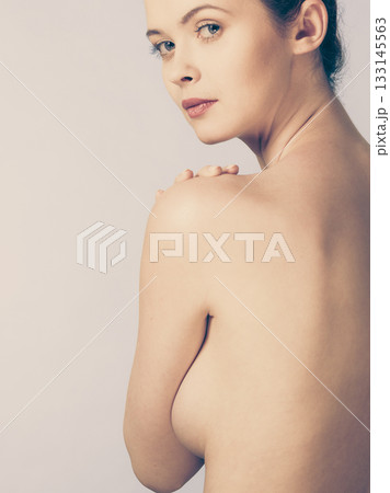 Bare woman covering her breast with hands Bare woman covering her breast with hands 133145563
